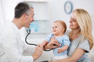 Pediatrician checking baby patient.